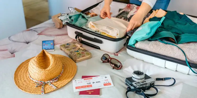 an image of a woman packing a suitcase 