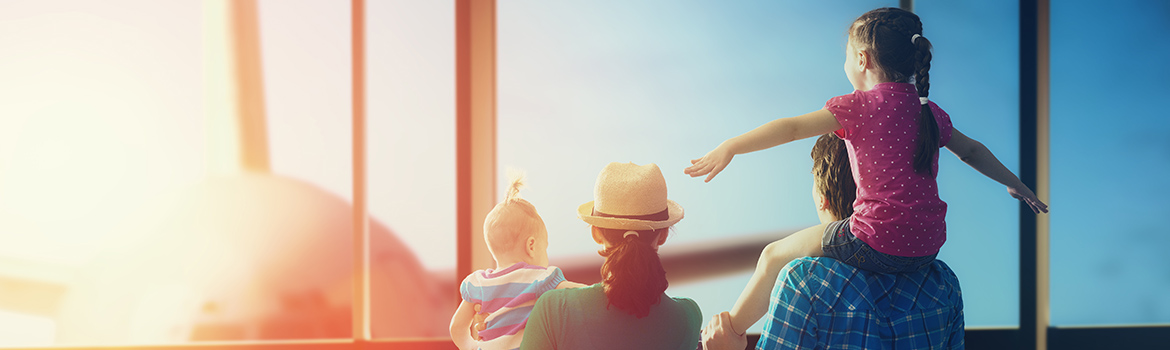 Image of family with children at the airport
