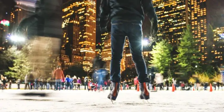People skating in central park at night time