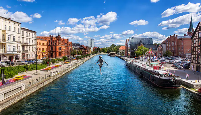 a person tightrope-walking across a river