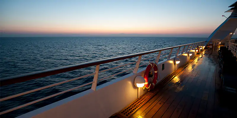 View of the sea from the deck of a cruise ship at dusk