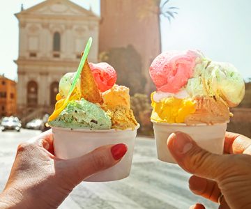Couple-with-beautiful-bright-sweet-Italian-ice-cream-with-different-flavors-in-the-hands