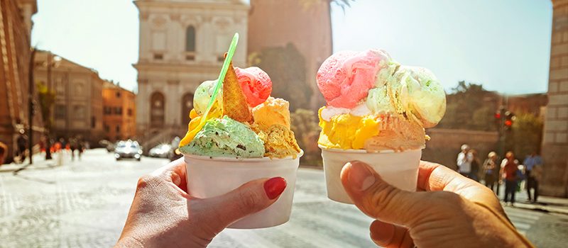 Couple-with-beautiful-bright-sweet-Italian-ice-cream-with-different-flavors-in-the-hands