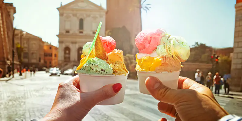Couple-with-beautiful-bright-sweet-Italian-ice-cream-with-different-flavors-in-the-hands