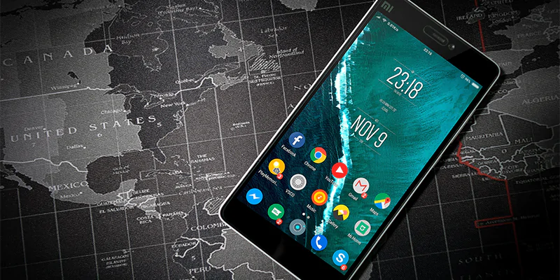 Mobile Phone Showing Popular Apps On A Map