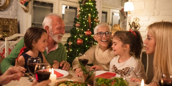 grandparents and grandchildren at Christmas dinner