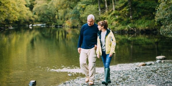 senior couple walking in the lake district