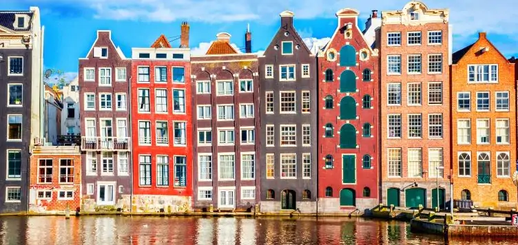 A view from the river of the dancing houses in Amsterdam