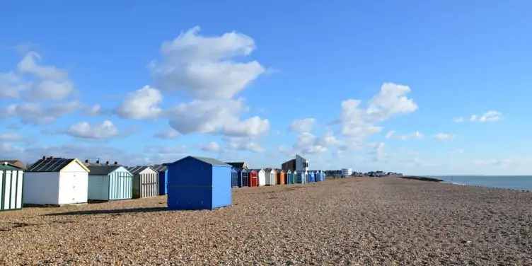 Rows of colourful beach huts sat on Hayling Island beach