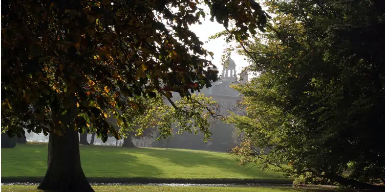 an image of Belton House, Lincolnshire, through the trees