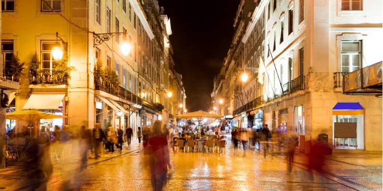 an image of Augusta Street in Lisbon, Portugal at night