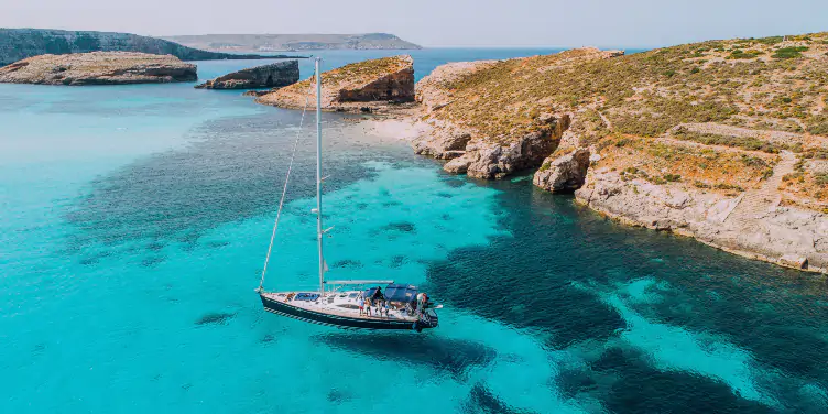 an image of a boat in the Blue Lagoon of Comino, Malta
