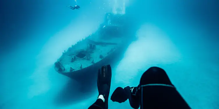 an image of divers exploring a shipwreck near Malta