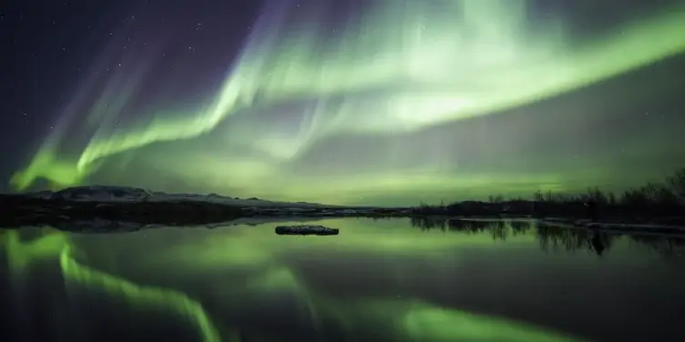 Northern lights over lake Thingvellir in Iceland
