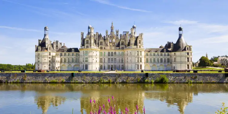 an image of Chambord chateau from across the canal