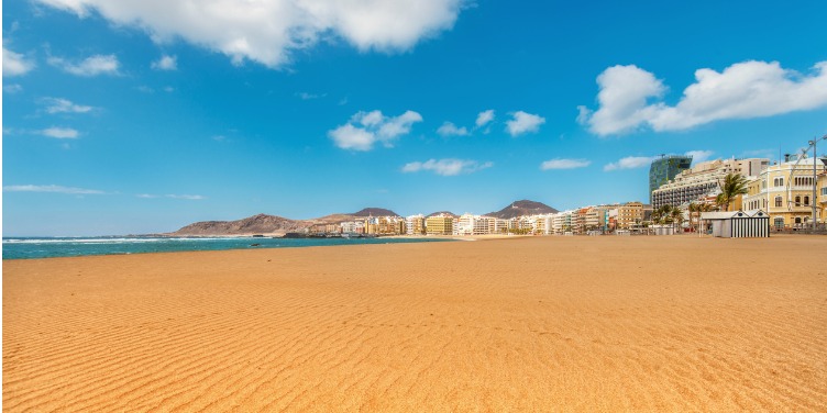 Empty golden beaches of Playa de Las Canteras beach in Gran Canaria
