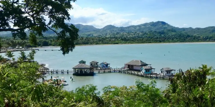 a cluster of buildings suspended on the water and connected to the land via bridges in Puerta Plata, Dominican Republic 