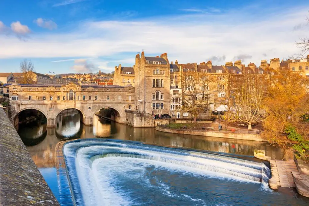 Pulteney Bridge above River Avon in Bath, England, United Kingdom on a sunny day.