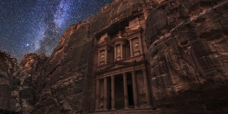 Ancient Petra with a starry night sky in the background