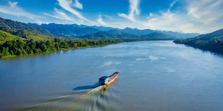 Ship cruising along the Mekong River