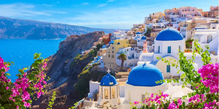 an image of the white houses in Santorini, Greece