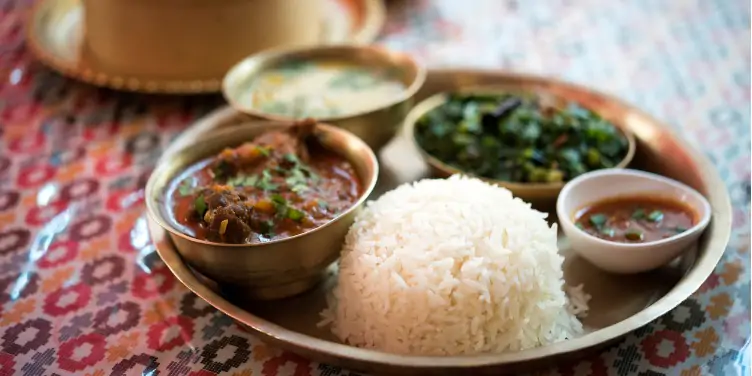 an image of a platter of Thakali, a traditional meal local to Pokhara, Nepal