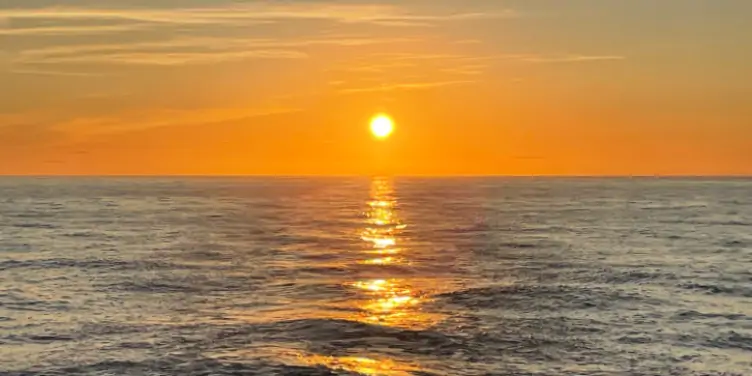 an image of the sunset over the North Atlantic Ocean from a cruise ship