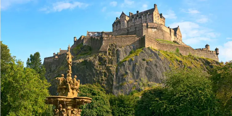 an image of Edinburgh Castle from Princes Street Gardens, with Ross Fountain in the foreground