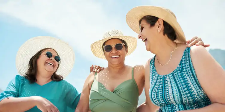 an image of three women laughing together
