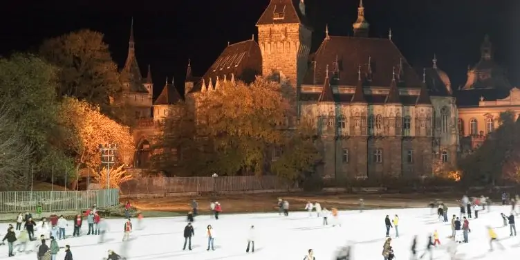 Winter outdoor ice skating in Budapest next to castle gardens. 