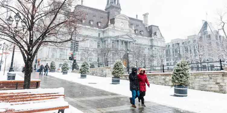 People walking in snow-covered Old Montreal