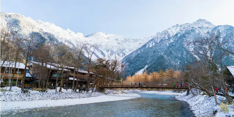 Village in Kamikochi National Park, Japan, at the foot of the Japanese Alps with river running through