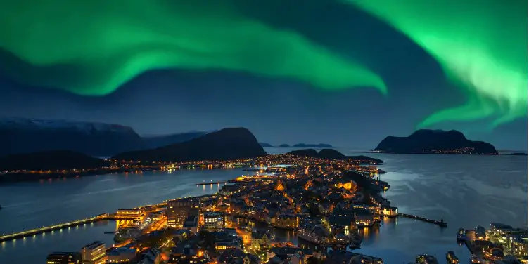 Northern lights above Alesund, Norway at night