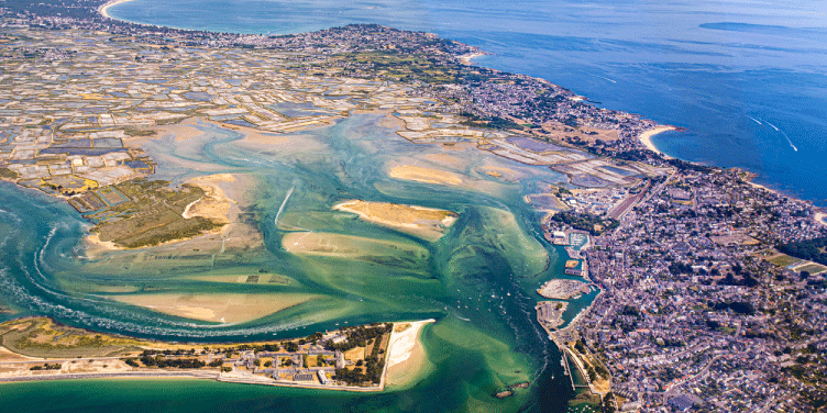 Ariel picture of the beautiful French seaside resort of La Baule with bright blue seas and a clear sky.